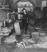  - Maria Luisa Righini Bonelli in the medical instruments room (with the cases of surgical instruments) after the flood