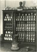  - The chemistry room on the ground floor. Display case containing pharmaceutical jars, Wedgwood’s retorts and bust of Raffaele Piria